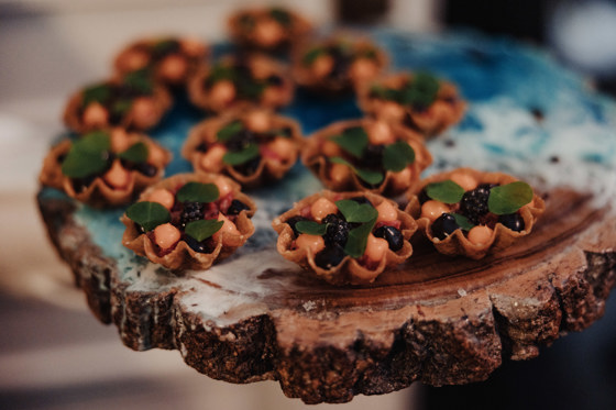 Canapés on a wooden platter by Dean Banks at The Pompadour